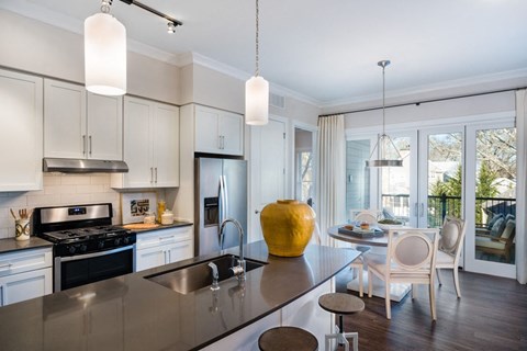 a kitchen with a large counter top and a sink